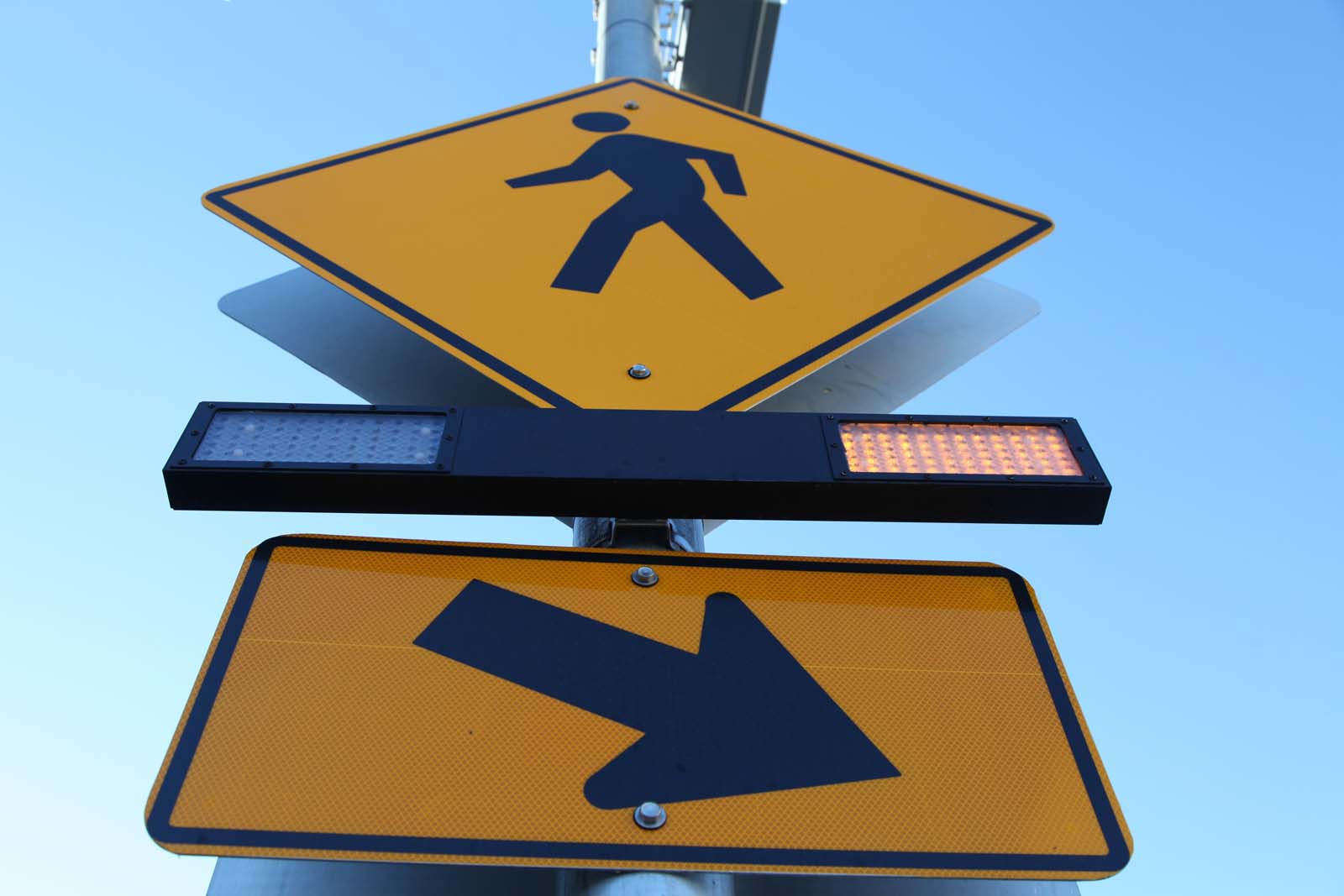 Sign with person walking