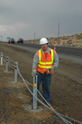 Cable barrier with worker