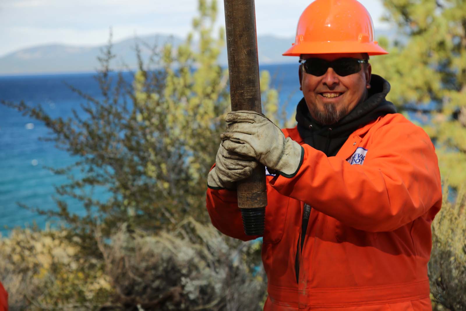 An NDOT employee in orange safety apparel at Lake Tahoe