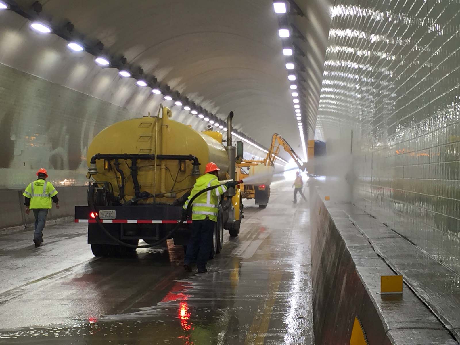 Water truck cleaning inside a tunnel