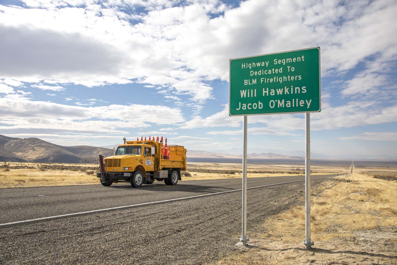 Road next to sign named for fallen officer